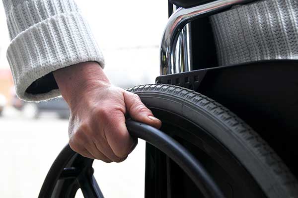 Hand on Wheelchair